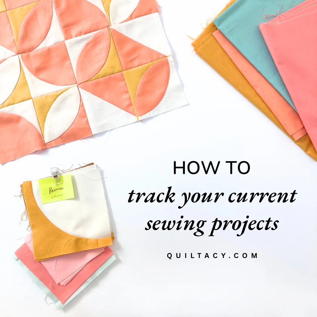 Coral and gold quilt blocks and folded fabrics with a labeled sticky note