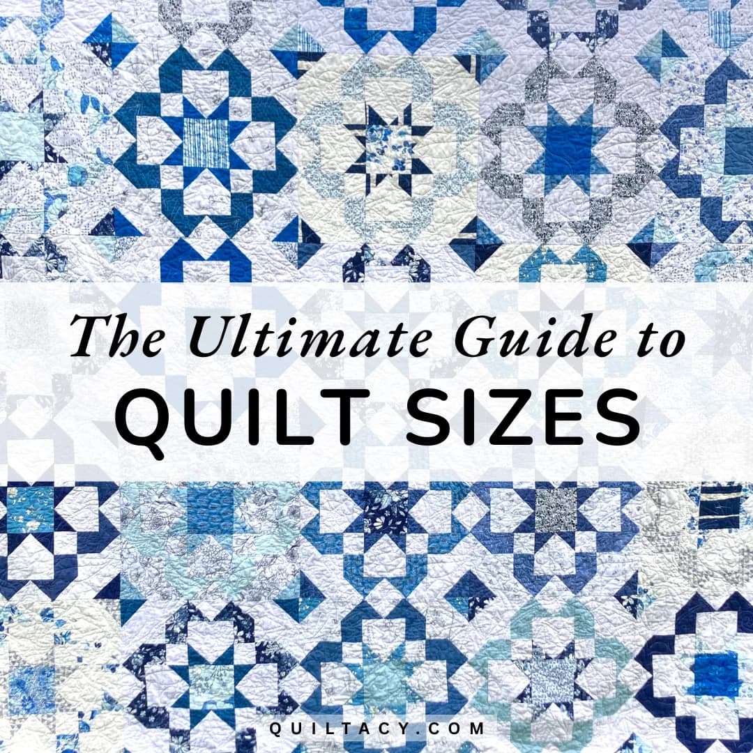 An array of blue and white patchwork quilts